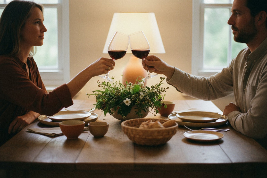 A couple toasting with wine at the dining table